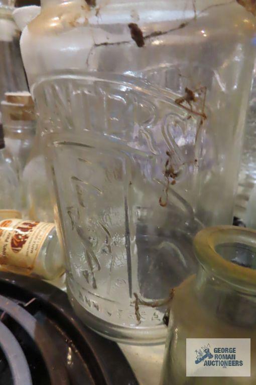 lot of assorted bottles and vintage Planters Peanut jar