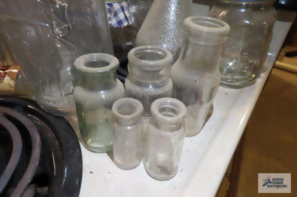 lot of assorted bottles and vintage Planters Peanut jar