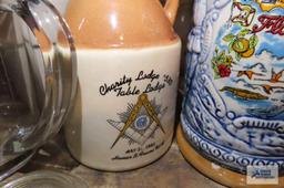 Assorted mugs, antique jars, and antique canning lids