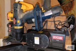 Two Ryobi drills with four batteries and two chargers