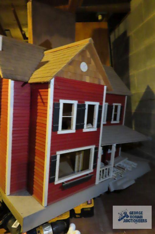 wooden dollhouse in basement