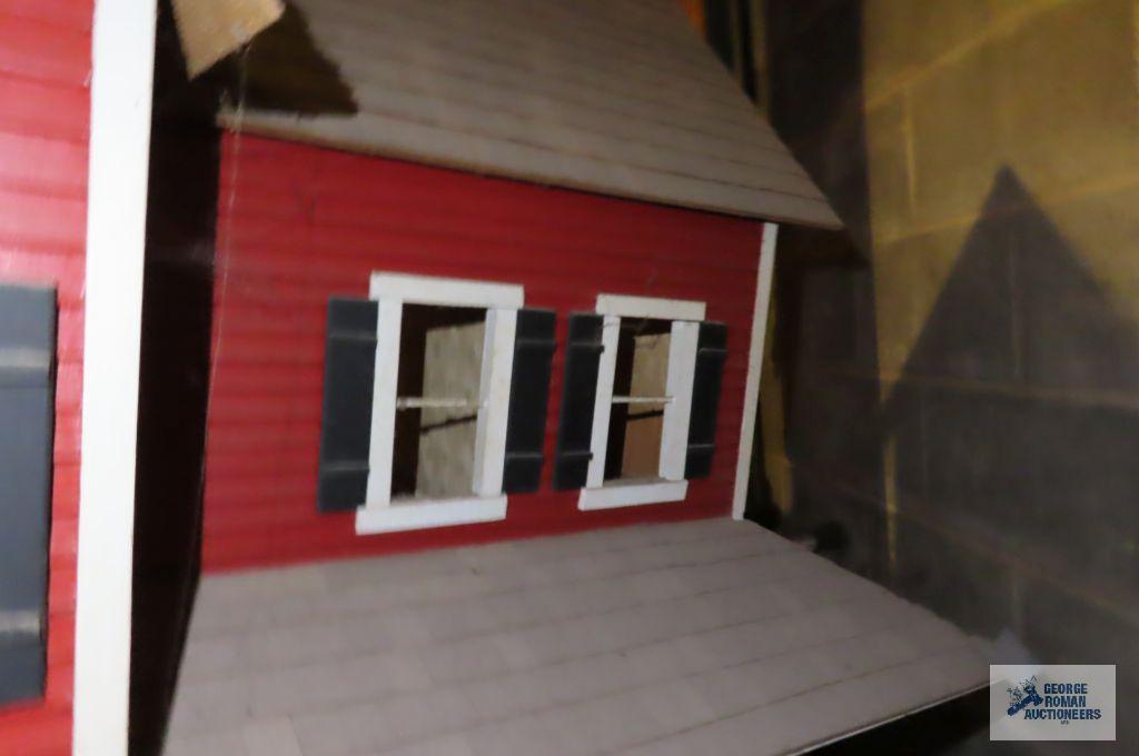 wooden dollhouse in basement
