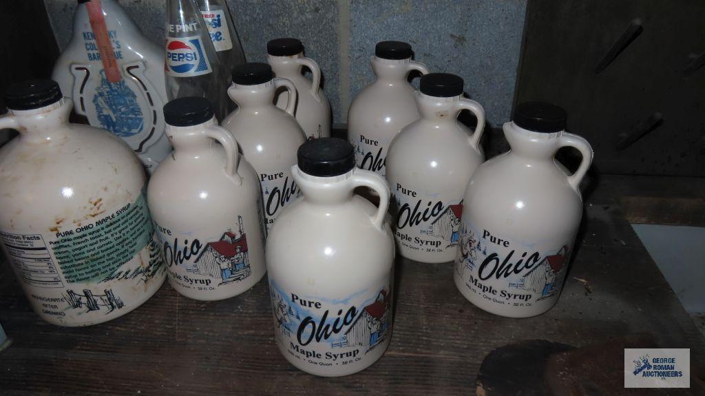 Ohio pure maple syrup plastic jugs, two Pepsi bottles, and Beam decanter