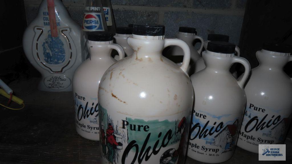 Ohio pure maple syrup plastic jugs, two Pepsi bottles, and Beam decanter