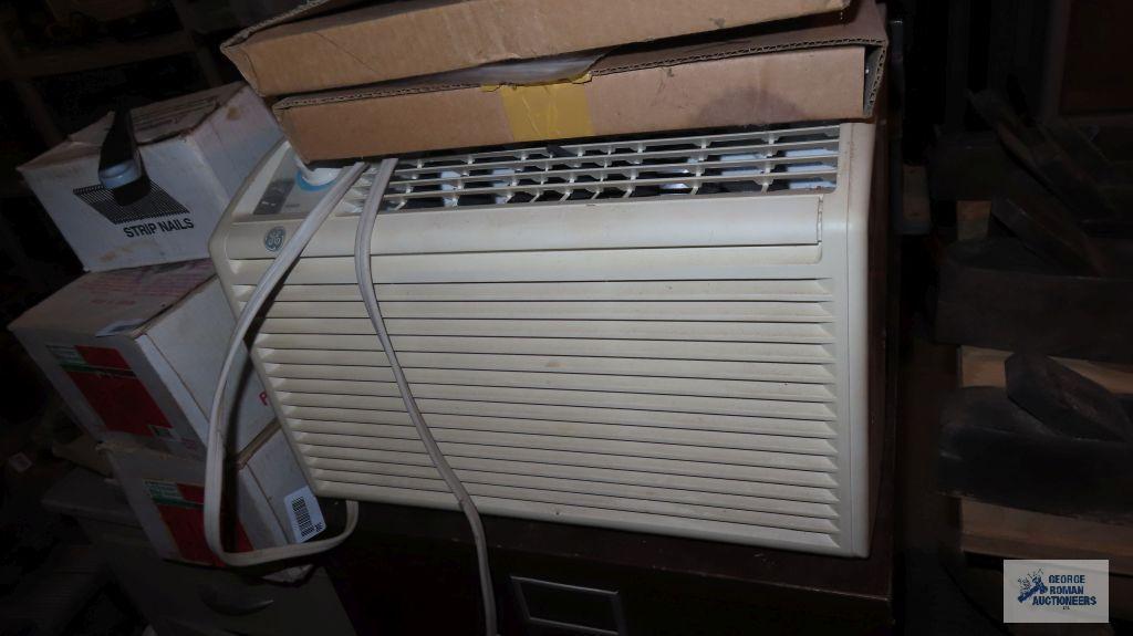 General Electric window air conditioner with accessories and remote. in basement