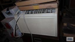 General Electric window air conditioner with accessories and remote. in basement