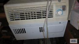 General Electric window air conditioner with accessories and remote. in basement