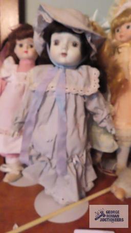 Four porcelain dolls