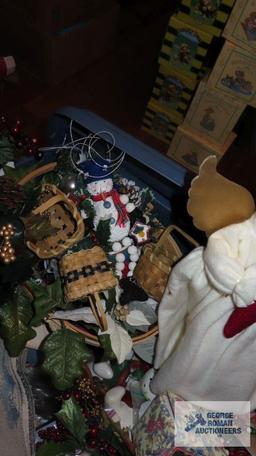 Tote of Christmas decorations, including runners and Angel and others