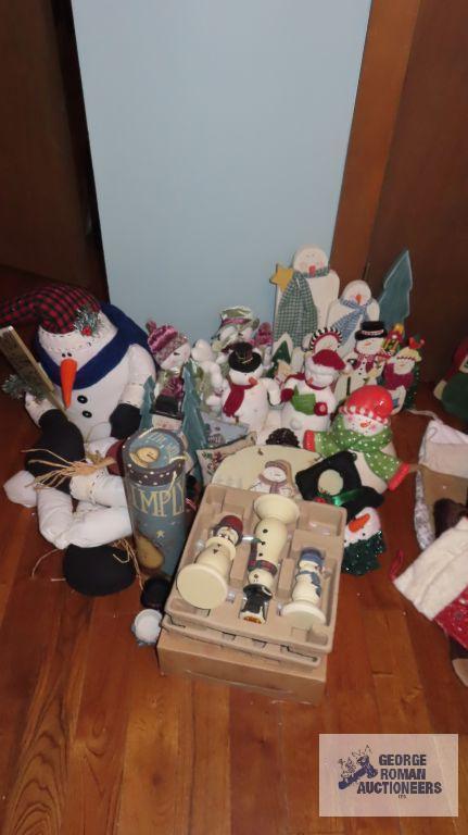Large variety of Snowman figurines,...decorations,...candlestick holders,...and others.