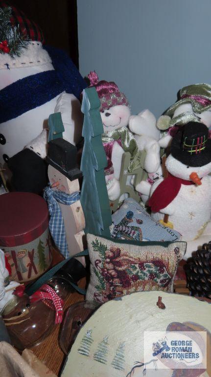 Large variety of Snowman figurines,...decorations,...candlestick holders,...and others.