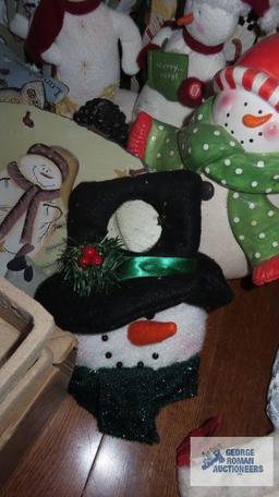 Large variety of Snowman figurines,...decorations,...candlestick holders,...and others.