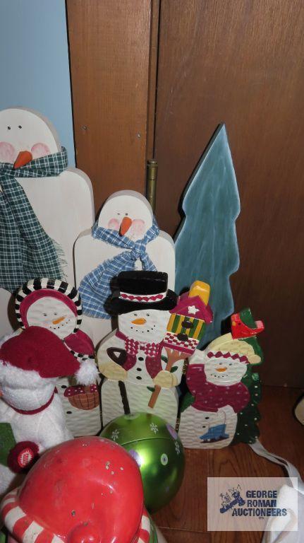 Large variety of Snowman figurines,...decorations,...candlestick holders,...and others.