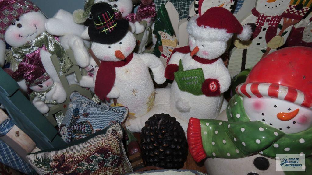 Large variety of Snowman figurines,...decorations,...candlestick holders,...and others.