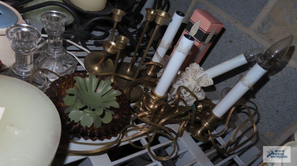 lot of candle holders and candles