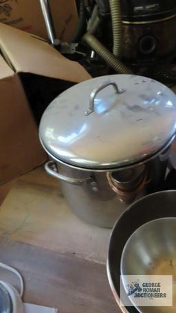 Large stainless steel pot. Heavy duty cast iron kettle. Other kitchen items