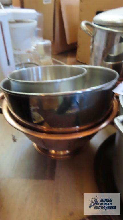 Large stainless steel pot. Heavy duty cast iron kettle. Other kitchen items