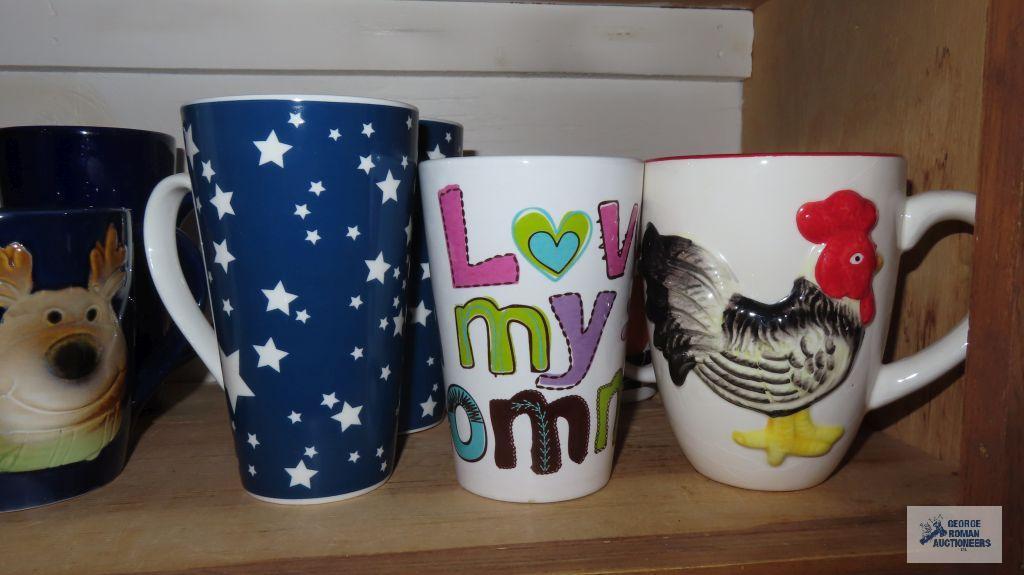 Cupboard lot of decorative mugs and soup bowls