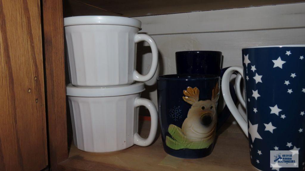 Cupboard lot of decorative mugs and soup bowls