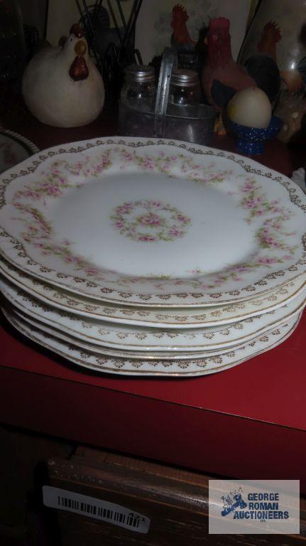 Variety of vintage dishes, plates, and saucers