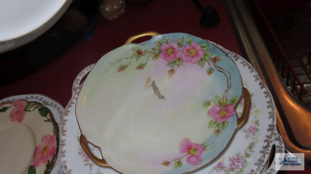 Variety of vintage dishes, plates, and saucers