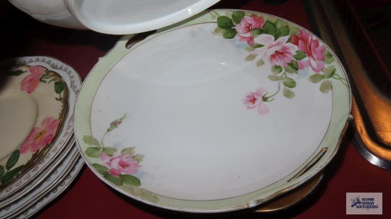 Variety of vintage dishes, plates, and saucers