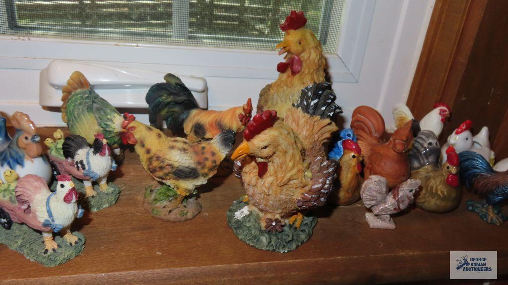 Windowsill full of chicken and rooster figurines