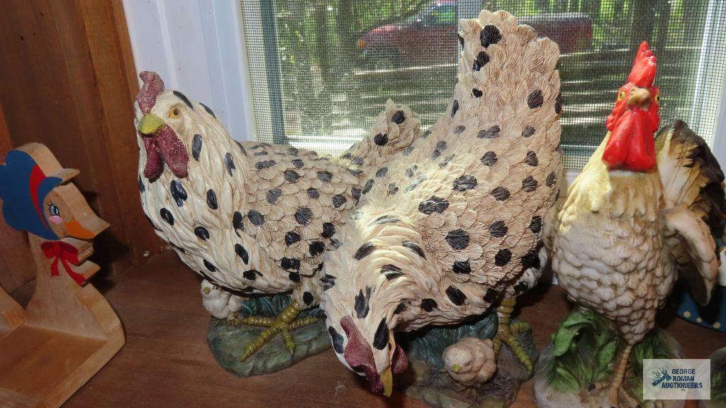 Windowsill full of chicken and rooster figurines