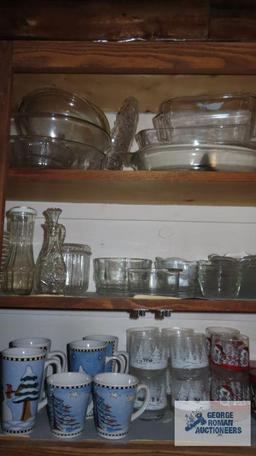 Cupboard lot of glass dishes,...Christmas glassware and mugs