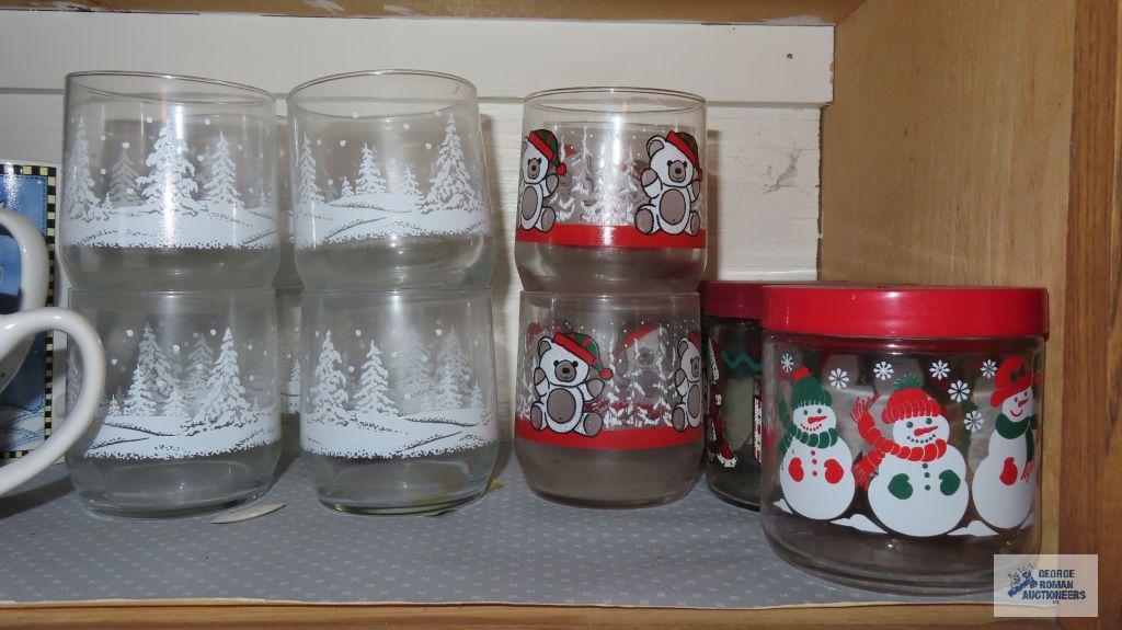 Cupboard lot of glass dishes,...Christmas glassware and mugs
