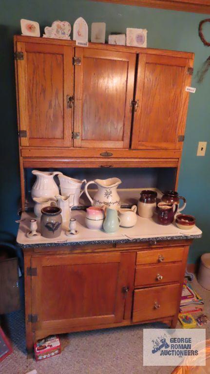 Oak Hoosier cabinet with porcelain shelves