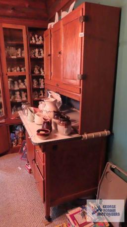 Oak Hoosier cabinet with porcelain shelves