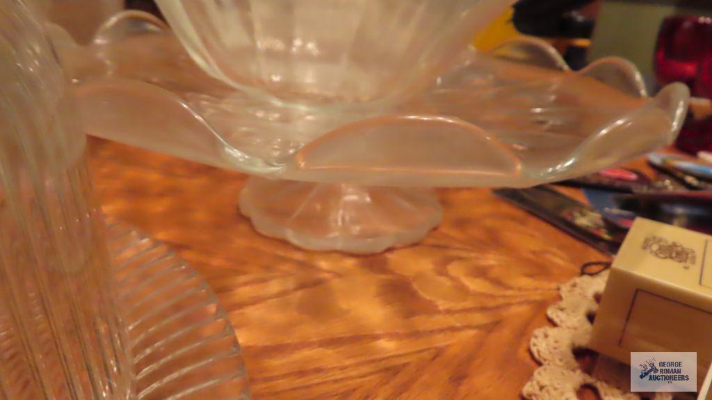 Lot of glassware, including salad bowl set. Cake stands. Covered cake dish. Serving platters.