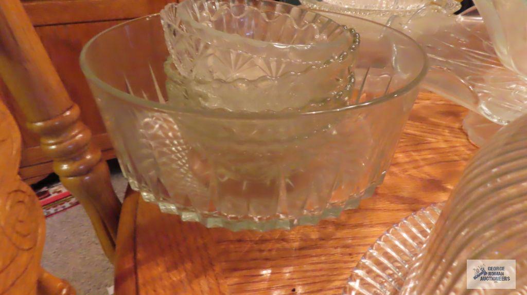 Lot of glassware, including salad bowl set. Cake stands. Covered cake dish. Serving platters.