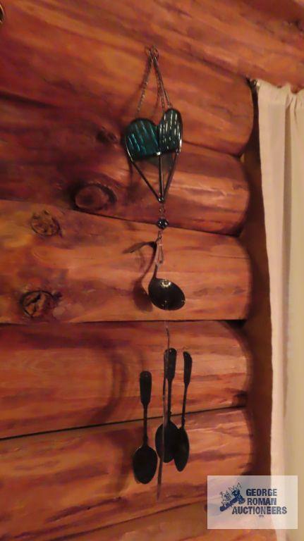 Assorted wind chimes and hanging items
