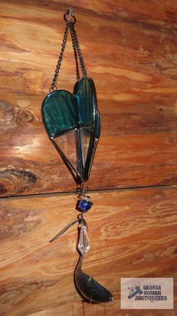 Assorted wind chimes and hanging items