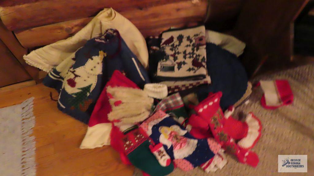 Assorted Christmas decorating items, including tree skirt and...stockings