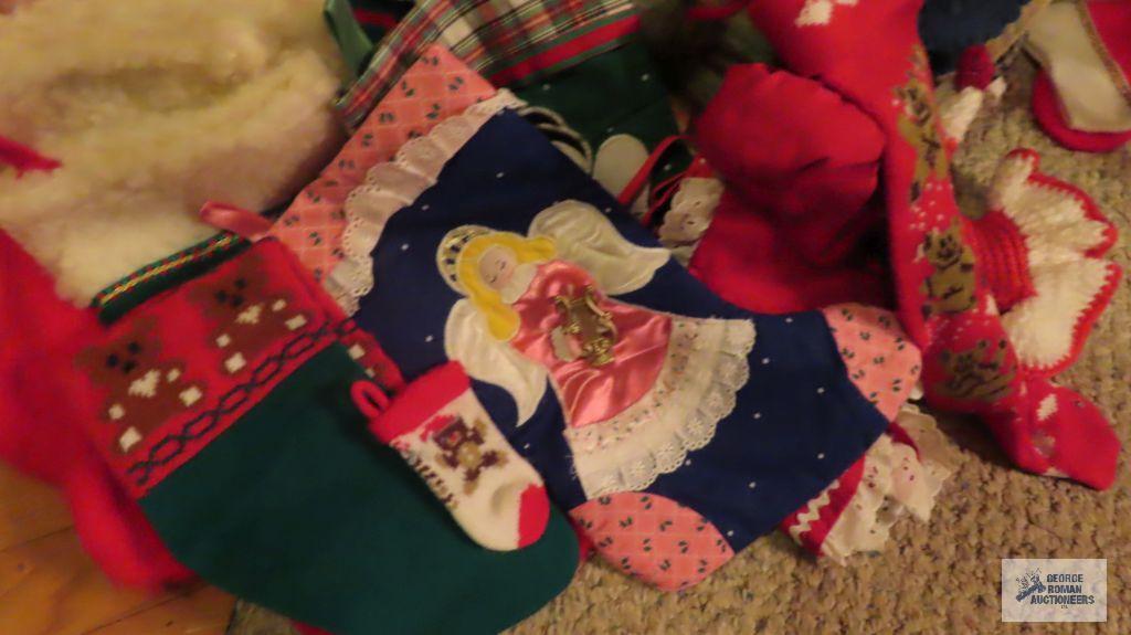 Assorted Christmas decorating items, including tree skirt and...stockings