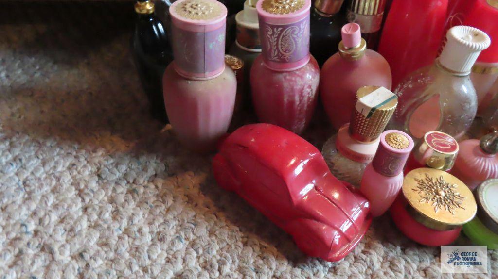 Large number of Avon bottles and figurine bottles