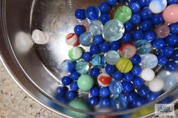 Tin with marbles