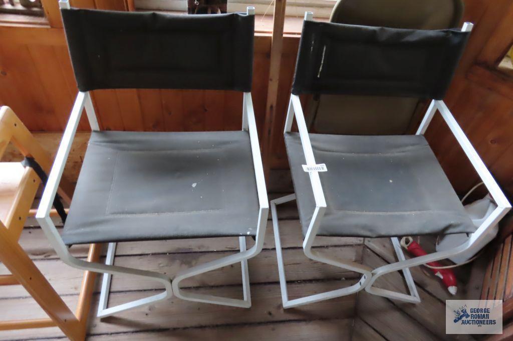 Pair of faux leather chairs with metal frames