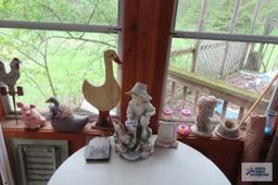 Lot of indoor and outdoor decorations with hummingbird feeders