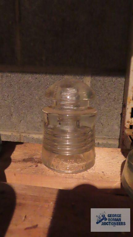 Three vintage clear glass insulators