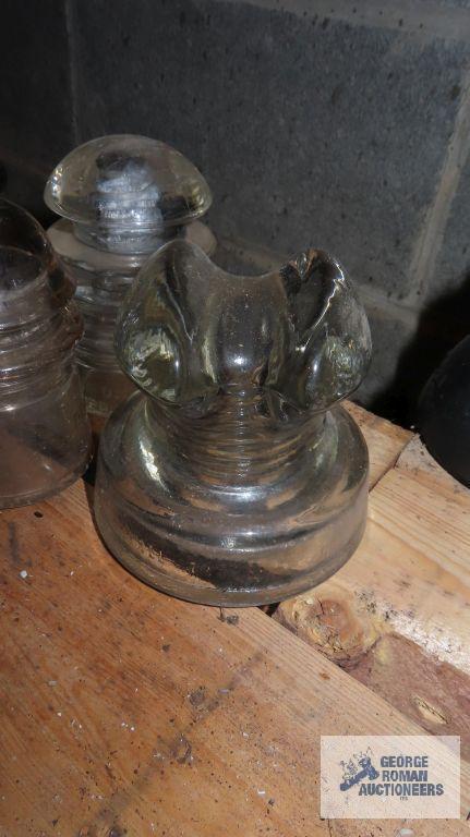 Three vintage clear glass insulators