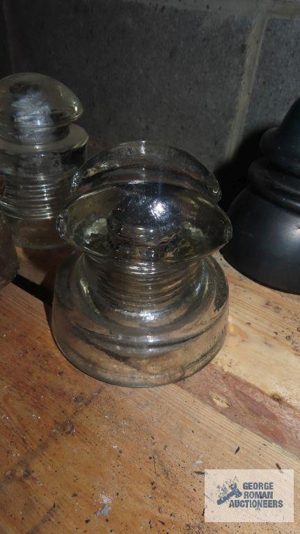 Three vintage clear glass insulators