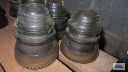 Five clear glass vintage insulators