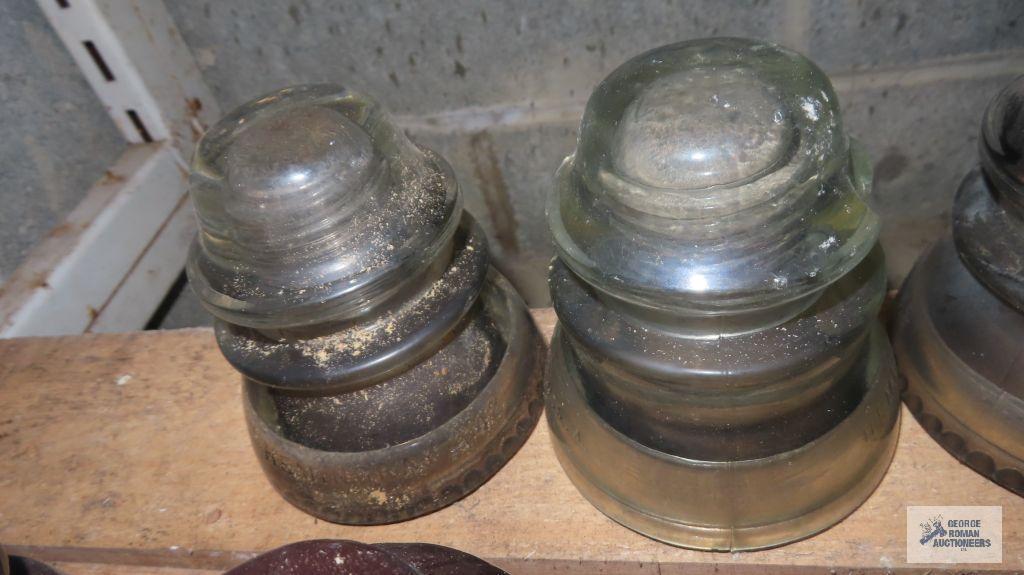 Five clear glass vintage insulators