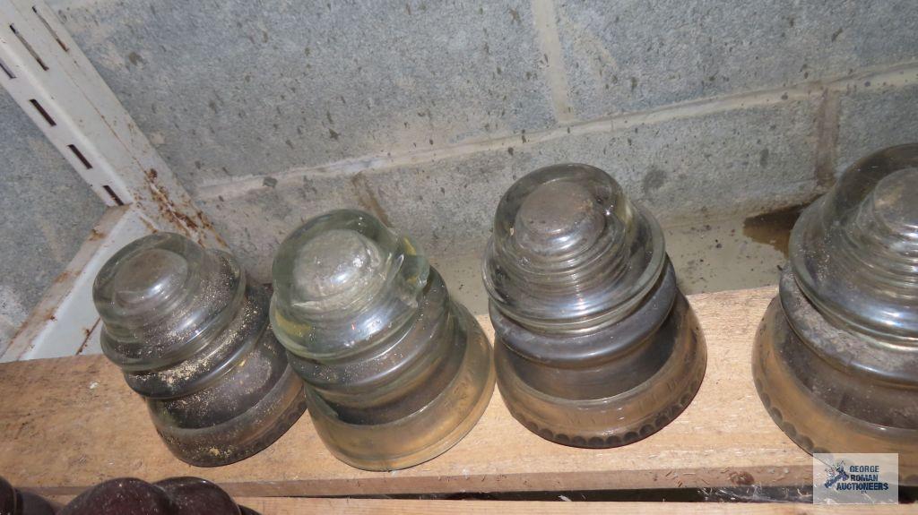 Five clear glass vintage insulators