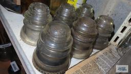 Six clear glass vintage insulators