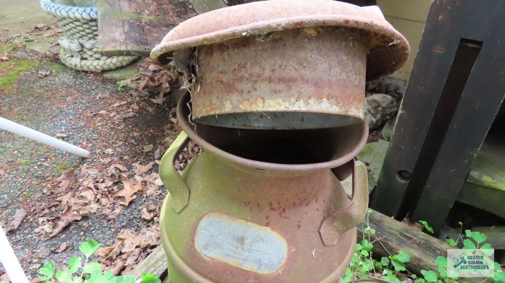 Antique milk can, gas can, student desk, outdoor table and planters